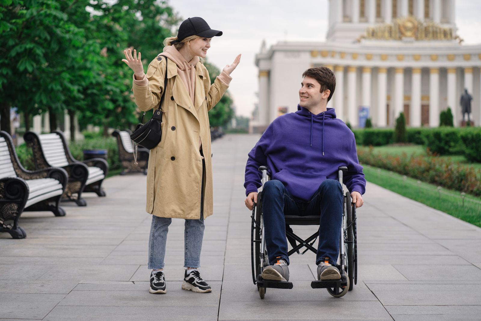Two adults connecting through conversation during a community park outing